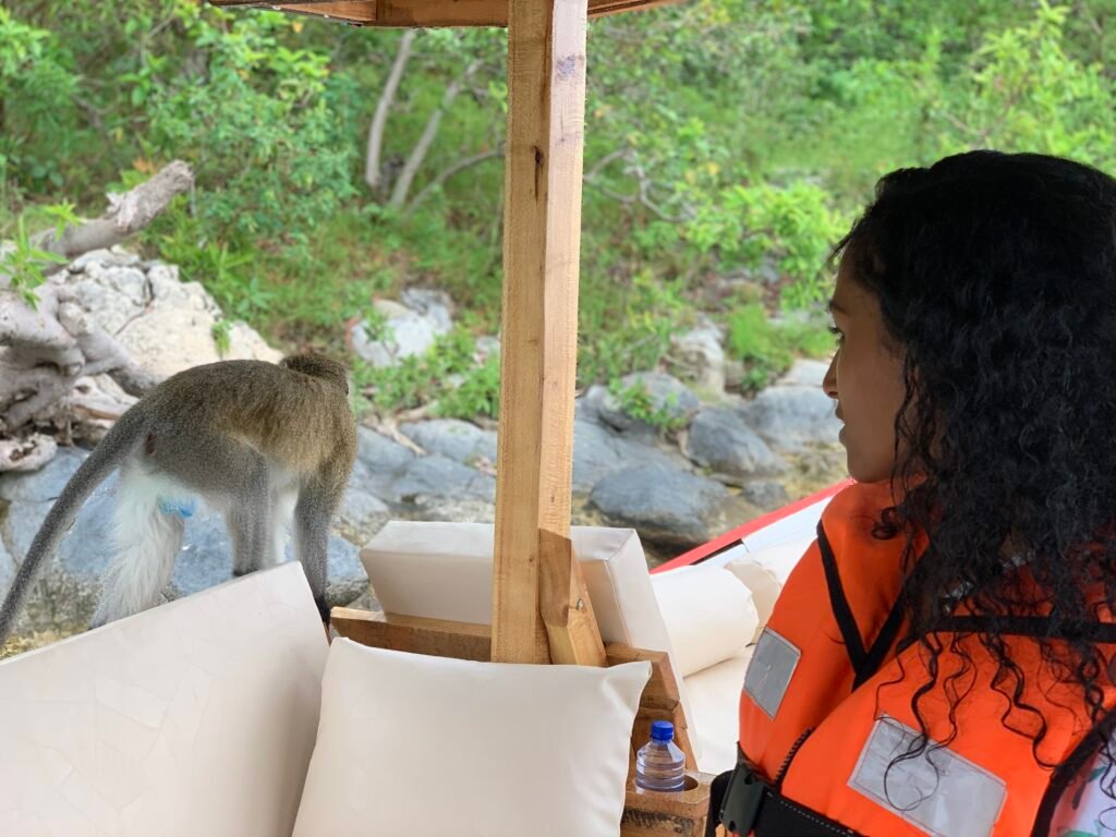 Visitors relaxing on a boat, taking in the beauty and fresh air of Lake Kivu.