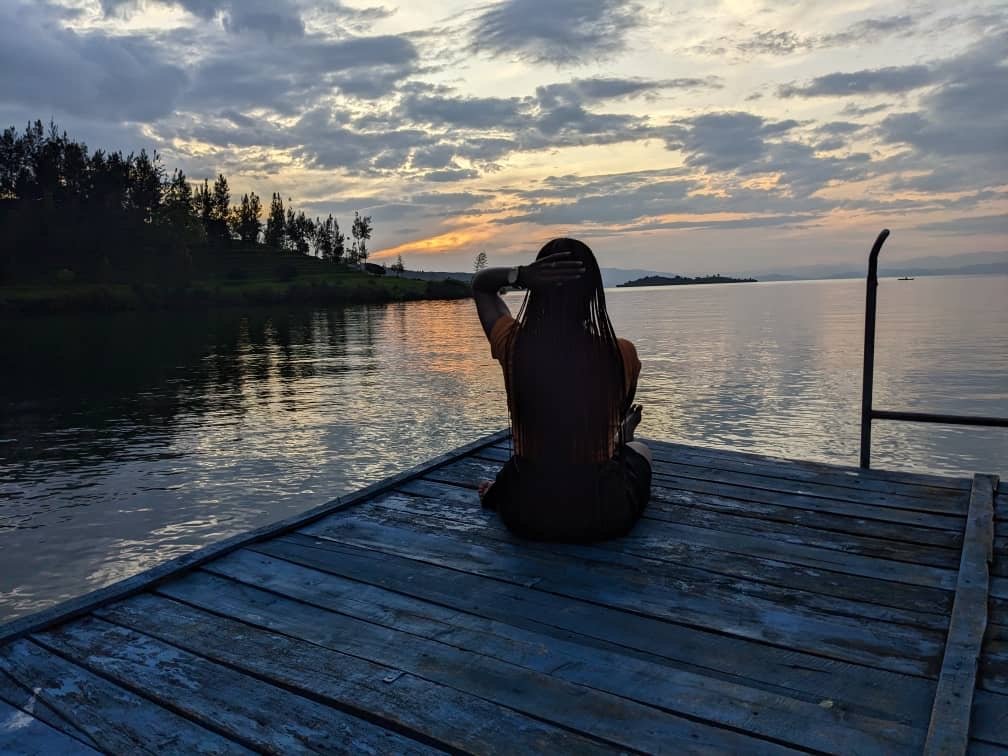 nice picture beautiful girl enjoy Sunset of lake kivu