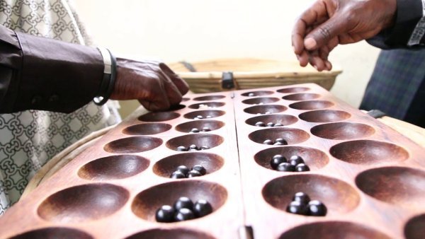 Discover Igisoro and Kubuguza, Rwanda’s ancient traditional strategy game. Learn the meaning of Nteba, Ngarama, Guteba, and explore authentic cultural experiences in Rwanda and Lake Kivu communities.